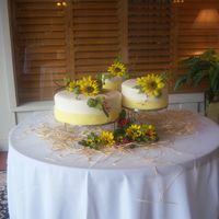 Sunflower Wedding All tiers were covered with ivory fondant and a yellow band of fondant at the bottom. Almond poppyseed, Marble, and White cake (with fresh...