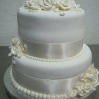 Anniversary Celebration Made for a client that wanted a nice anniversary cake. It was my first time using Satin Ice fondant and I'm hooked!