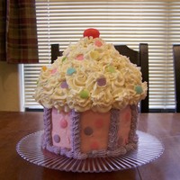 Tessaa's Cupcake Big cupcake. I did one with the wilton cupcake pan, and this one using 6" pans and a bowl for the top. I did not like the way the...
