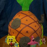 Spongebob Squarepants! Who lives in a pineapple under the sea!? Made for a Birthday party. :) Triple chocolate cake filled with cookies and cream filling, covered...