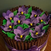 Purple Pansy Cake My mom in law wanted a cake... purple and pansies were her input and this is what I came up with. Four layer lemonade cake with cream...