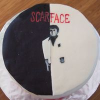 Scarface Made for a friend who wanted a scarface cake in memorial of her son. Triple chocolate cake, covered in vanilla BC, and then covered in MMF...