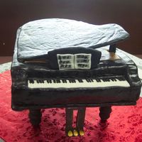 Grand Piano Chocolate cake with peppermint filling, covered in chocolate BC, MMF over all. Carved from an 11x15 pan. Made the base with foam board and...