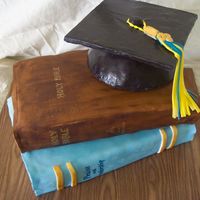 Books And Grad Cap Made for a friend graduating from a Christian College, with a Worship Arts degree. Made a half sheet cake, half chocolate and half vanilla...