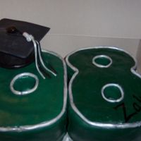 Graduation Cake '08 Vanilla cake with cream cheese filling, covered in vanilla buttercream and covered and deco'ed in fondant.