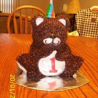 Bear Cake Bear cake I made for my daughter's first birthday. Real cute. :) Chocolate cake/brownie mixes, store bought icing.