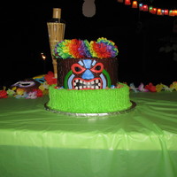 Tiki Luau Cake Made this cake from a picture I found on a bakery website. It went perfect with my son's 13th Birthday Party. Its a two tier cake, the...
