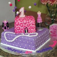 Hannah's 1St Diva Birthda Cake was made to match the birthday invitations. WASC cake from CC that was delicious...covered in MMF, with MMF pearl necklace..the purse...