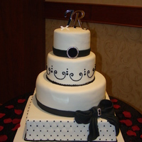 Black And White Wedding Cake My cousin's wedding cake I made for them...and travelled 6 hours in a vehicle in the middle of winter on Alberta's bumpy roads....