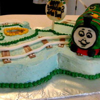 Thomas The Train I had to shape the cake into a 3 and made thomas out of cake as well. All covered in buttercream. I got the idea off cake central :)