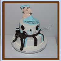Brown & Blue Baby Boy! Babyshower cake done to match the color scheme of brown & blue. 8" & 10" vanilla cake filled and iced with vanilla BC....