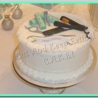 Tools For The Hair Stylist! Cake done around Christmas for a hair stylist. All styling "tools" are made from fondant. Vanilla cake iced in buttercream....