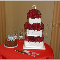 The Plumber And The Bride Wedding cake done for a dear friend two days after Christmas '09. Lemon cake filled with vanilla buttercream and covered in fondant....
