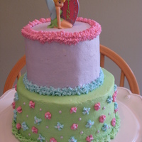 Tinkerbell Cake Buttercream frosting with candle topper