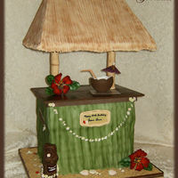 Tiki Bar 28" Tall with gumpast flowers, chocolate shells, gumpaste coconut drink filled with piping gel "drink".