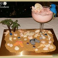 Margaritaville Theme Grooms Cake Glass contains a 6" Strawberry Margarita Cake with Strawberry-Lime Buttercream. The parrot is hand molded, salt shaker, chocolate...