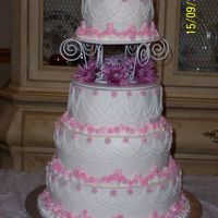 Wedding Cake This was my first wedding cake and I'm extremely proud of the way it turned out! :) All BC icing with royal icing drop flowers.