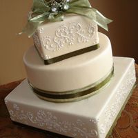 Dsc06157.jpg More for my portfolio. Dummy cake. Fondant and RI piping.