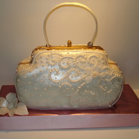 Handbag Cake White fondant with pearl luster dust. FV cake and filling