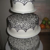 Black And White This was a wedding cake for my little cousin's wedding. He wanted black and white. IT is all buttercream.