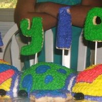 Caterpillar Cake Took me three days to finish this, but it was for my cousin's birthday party for 10 little girls. they loved it! I used 3 different...