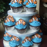 Nemo Cupcakes I got the idea from krystalp and took a stab at it! I loved how you could do the Nemo's ahead of time and then bake off the cupcakes...