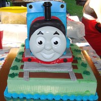 Thomas The Tank Top layer is yellow cake with vanilla buttercreamBottom layer is chocolate cake with raspberry itailian buttercream