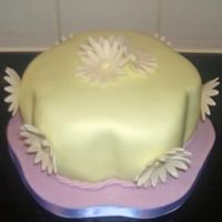 Nana's Mothers Day Cake Here is a cake I made for my nana for mother's day, it's vanilla cake with vanilla buttercream covered in fondant with flower...