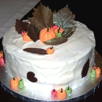 Fall Cake Carrot Cake with Cream Cheese Frosting. Chocolate leaves, gum paste pumpkins and pears.