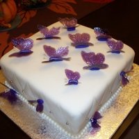 Gelatin Butterfly Thank you to bobwonderbuns for the inspiration. Gelatin butterflies on marshmallow fondant covered cake.