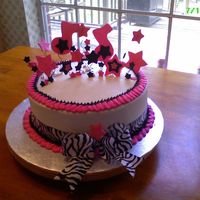Hot Pink And Zebra Cake I had alot of fun doing this cake! Ribbon is fabric ribbon due to time constraint, and has music notes and stars on top!