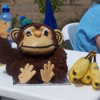 Monkey Cake My sons cake for his birthday. The monkeys legs are crossed, its just hard to tell in the picture.