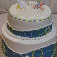 Baby Boy Blue Cake This was for my friends sisters Baby Shower. Triple Chocolate Cake with Ganache filling.... Butter cream frosting and decorations.