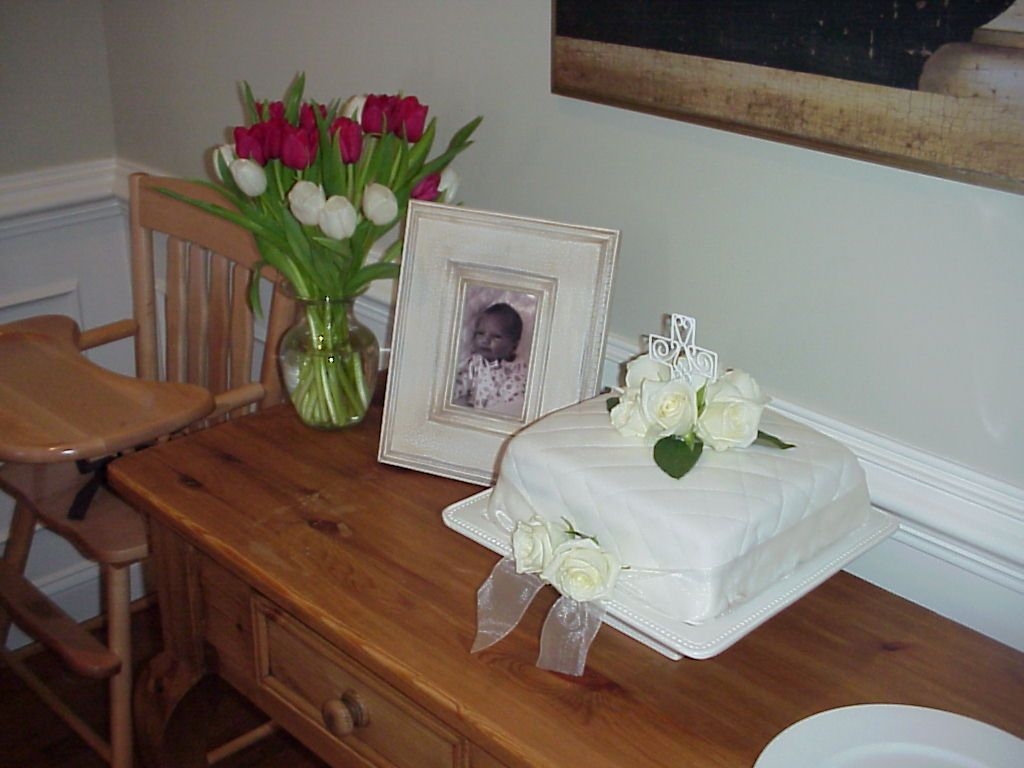 Jackson's Baptism Cake This was for my son's baptism - the first cake I ever did! White cake with white buttercream and hazelnut mousse.
