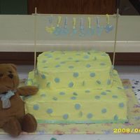 Yellow & Blue Baby Shower Cake Yellow BC icing w/blue fondant circles. The letters are also blue fondant. All pieces on clothesline are from Wal-Mart. The air conditioner...