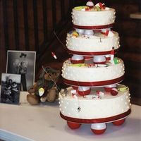 80Th Fishing Birthday Inspired by bellsnbows. White cake, 14in 12in 10in 8in. BC Icing, red fabric ribbon. Red electrical tape wrapped around the Wilton balls...