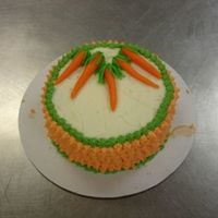 Carrot Cake Carrot Cake decorated with Buttercream and Marzipan Carrots.