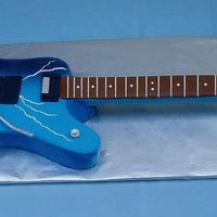 Dean Lightning Bolt Guitar My first attempt making a guitar replica! 3/4-lifesize of my son's favorite guitar. Overall length - 36 in. Body of the guitar was...