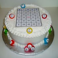 Bingo Cake Birthday cake for an avid Bingo player. 8 in. round marble cake covered in BC. Base of Bingo card and balls were fondant. Card was printed...
