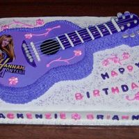 Hannah Montana Guitar Cake BC with fondant and edible image trims. Wilton's guitar pan and 12X18 sheet pan. So much fun to make for cousins sharing a birthday!...