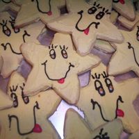 100_0606.jpg I made these cookies for my daughters birthday party. The theme was care bears. I was short on time and had to rush to put the faces on...