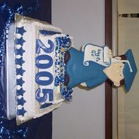 100_0572.jpg Very fun cake to make. I used chocolate to mold the grad. and stars.