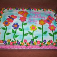 100_0613.jpg This cake was for a 2 year olds birthday. I used fondant for the flowers and butterflies. Loved making this cake, lots of fun.