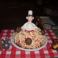 Ratatouille Cake I had fun making this cake. The Spaghetti and figures are fondant.