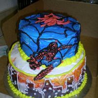 Spiderman Cake Chocolate fudge cake with cherry-vanilla buttercream filling. Buttercream icing, color flow spiderman. Airbrushed city scape.I swirled the...