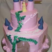 Castle Cake Castle cake frosted with buttercream. Princess made out of fondant.Inspired by a picture provided by client.