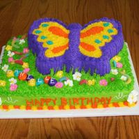 Gd Butterfly Bd Butter Cream frosting, Butterfly pan - modified, sour gummy worms, royal frosting flowers, for my Grand Daughter's 11th birthday.