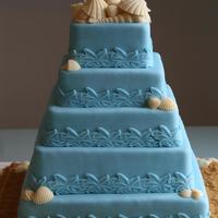 Beach Wedding Coconut cake with white chocolate ganache.14" 12" 10" 8" & 6"