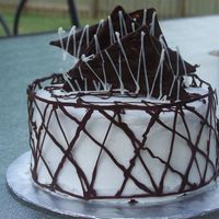 White And Dark Chocolate Cake Just playing around with candy melts. For a 1st try with a chocolate wrap, not too bad I think. I'll keep working at it.