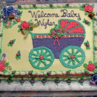 Welcome Baby Wyler This cake for a baby shower for a girl at church. I did the baby buggie with butter cream icing stared in, the clip art was from the...